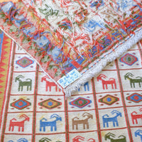 Persian Sumak flatweave rug showing wrapped-weft construction and stylised tribal motifs