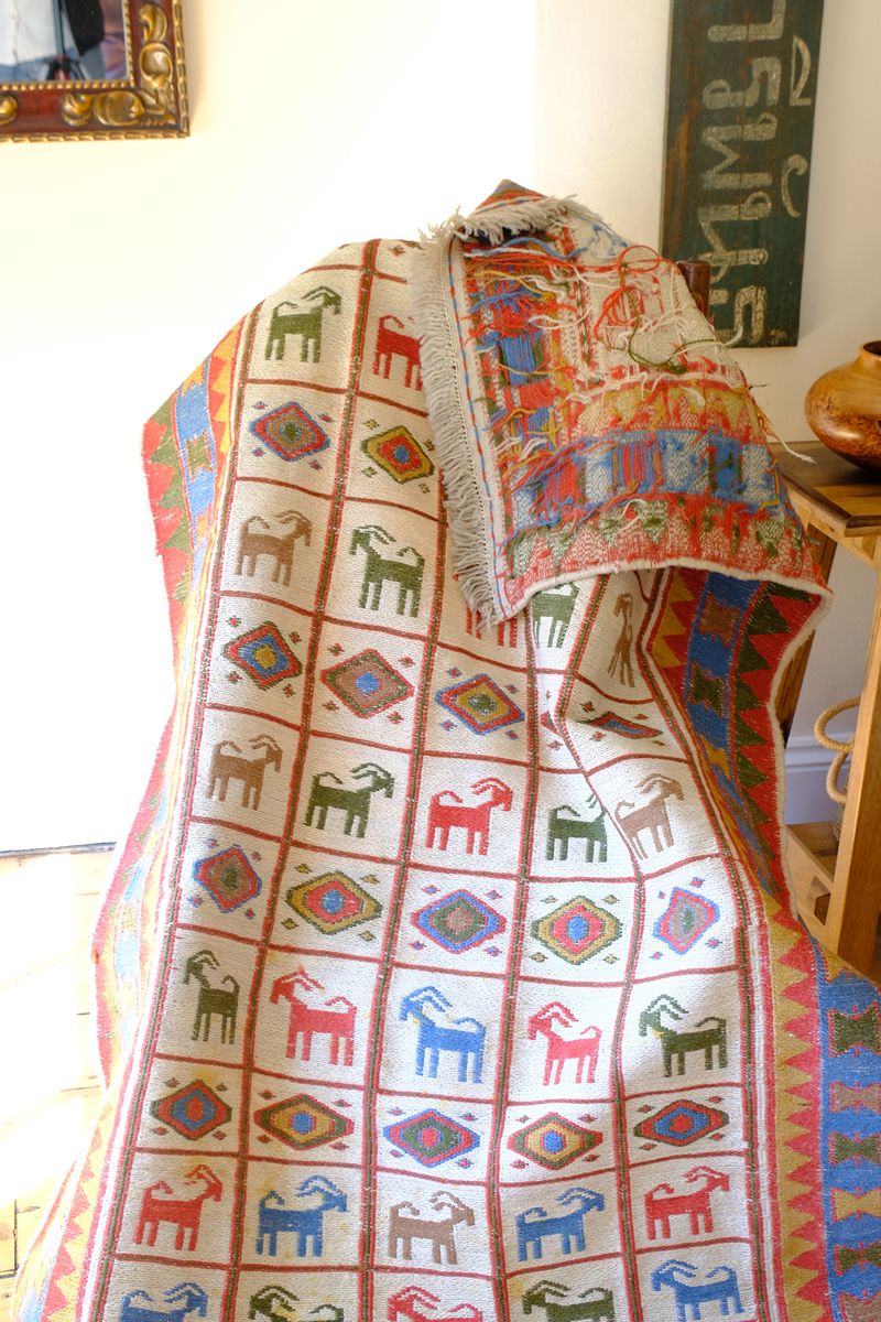Traditional Persian Sumak wool flatweave rug with repeating goat motifs and geometric design