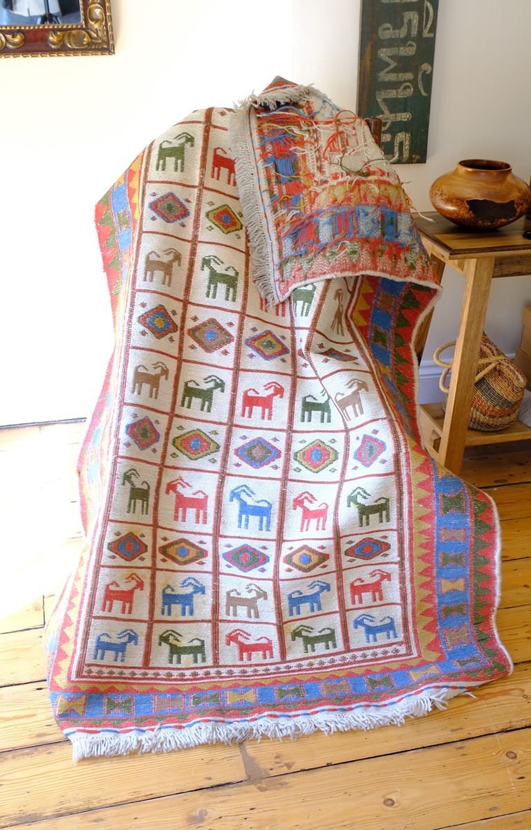 Traditional Persian Sumak wool flatweave rug with repeating goat motifs and geometric design
