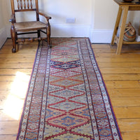 Mid-20th Century North-West Persian ivory ground hand-knotted wool runner with fourteen hooked lozenge medallions