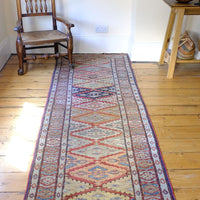 Mid-20th Century North-West Persian ivory ground hand-knotted wool runner with fourteen hooked lozenge medallions