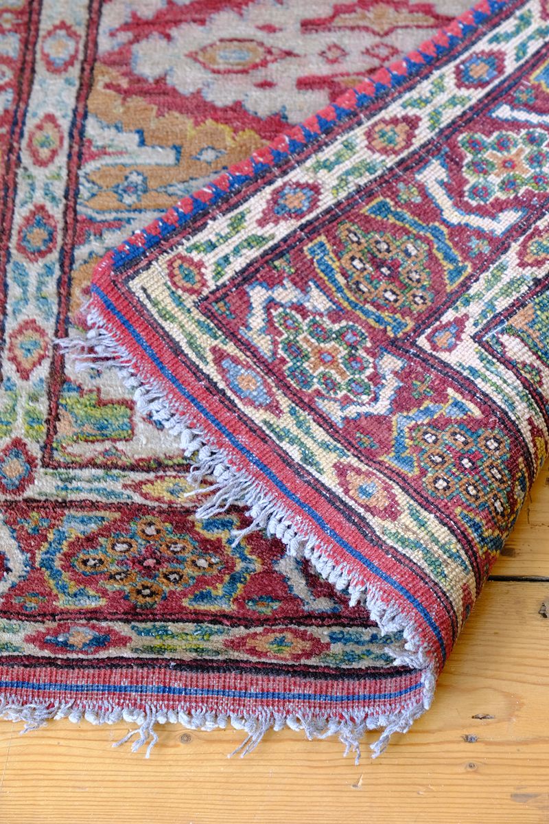 Back of the Mid-20th Century North-West Persian ivory ground hand-knotted wool runner with fourteen hooked lozenge medallions
