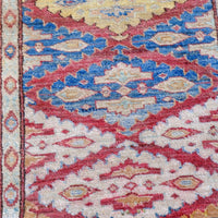 Mid-20th Century North-West Persian ivory ground hand-knotted wool runner with fourteen hooked lozenge medallions