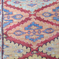 Hooked lozenge medallions on the Mid-20th Century North-West Persian ivory ground hand-knotted wool runner with fourteen hooked lozenge medallions