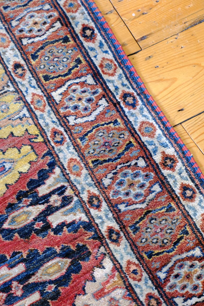 Mid-20th Century North-West Persian ivory ground hand-knotted wool runner with fourteen hooked lozenge medallions