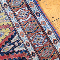 Mid-20th Century North-West Persian ivory ground hand-knotted wool runner with fourteen hooked lozenge medallions