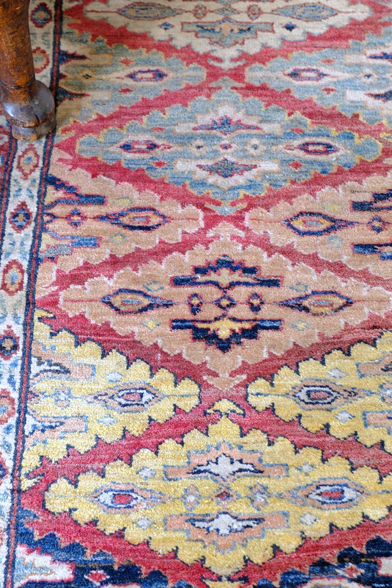 Mid-20th Century North-West Persian ivory ground hand-knotted wool runner with fourteen hooked lozenge medallions