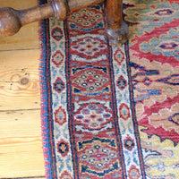 Mid-20th Century North-West Persian ivory ground hand-knotted wool runner with fourteen hooked lozenge medallions
