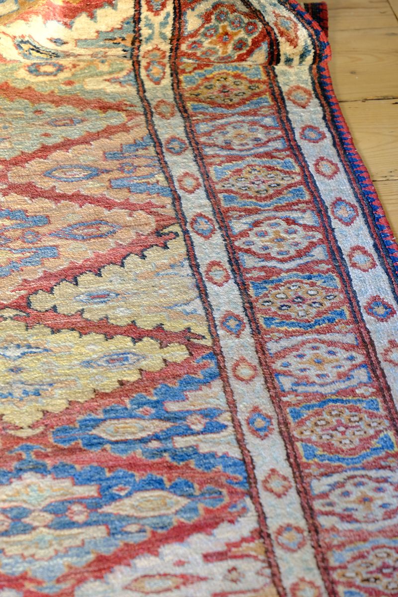 Mid-20th Century North-West Persian ivory ground hand-knotted wool runner with fourteen hooked lozenge medallions