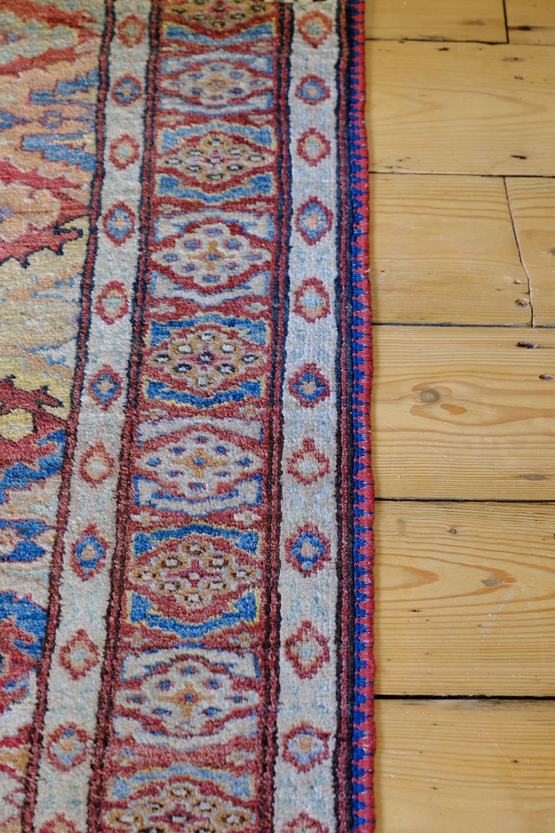 Mid-20th Century North-West Persian ivory ground hand-knotted wool runner with fourteen hooked lozenge medallions