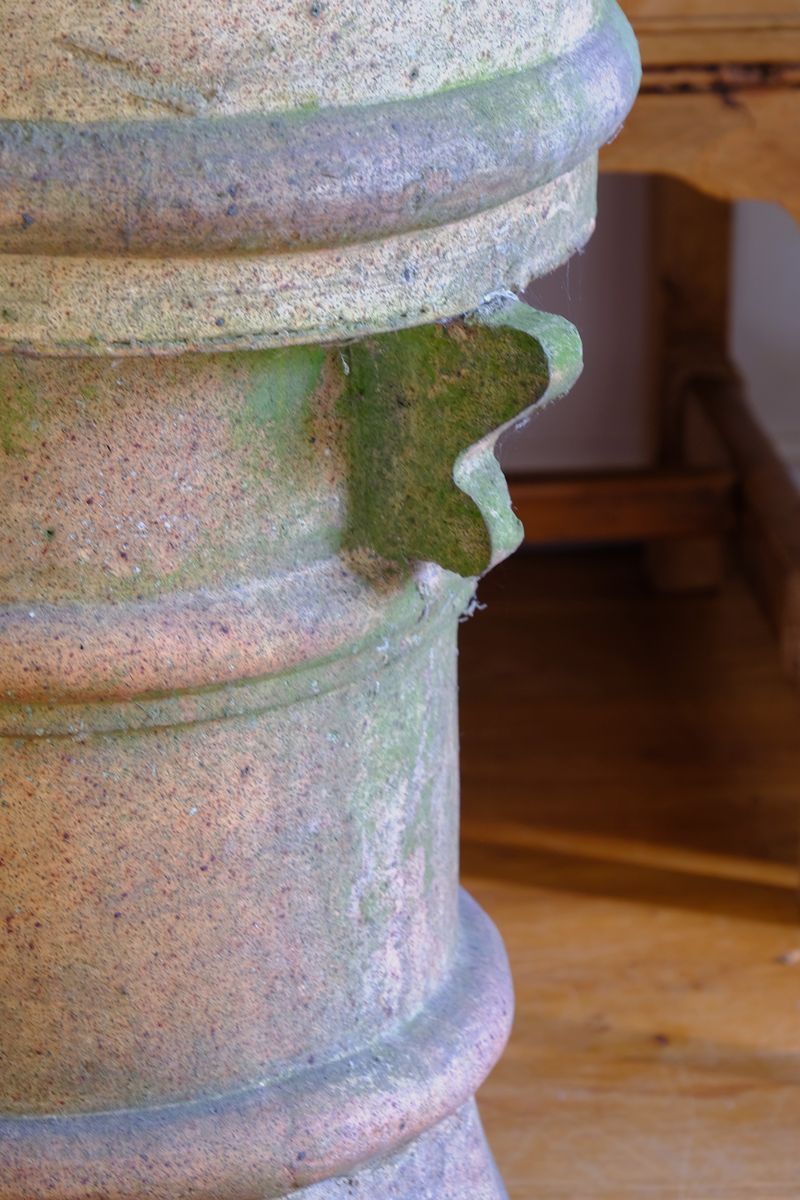 Corbel close up ornamentation - Late Victorian English buff terracotta crown chimney pot c.1880 with vented body and moulded architectural decoration