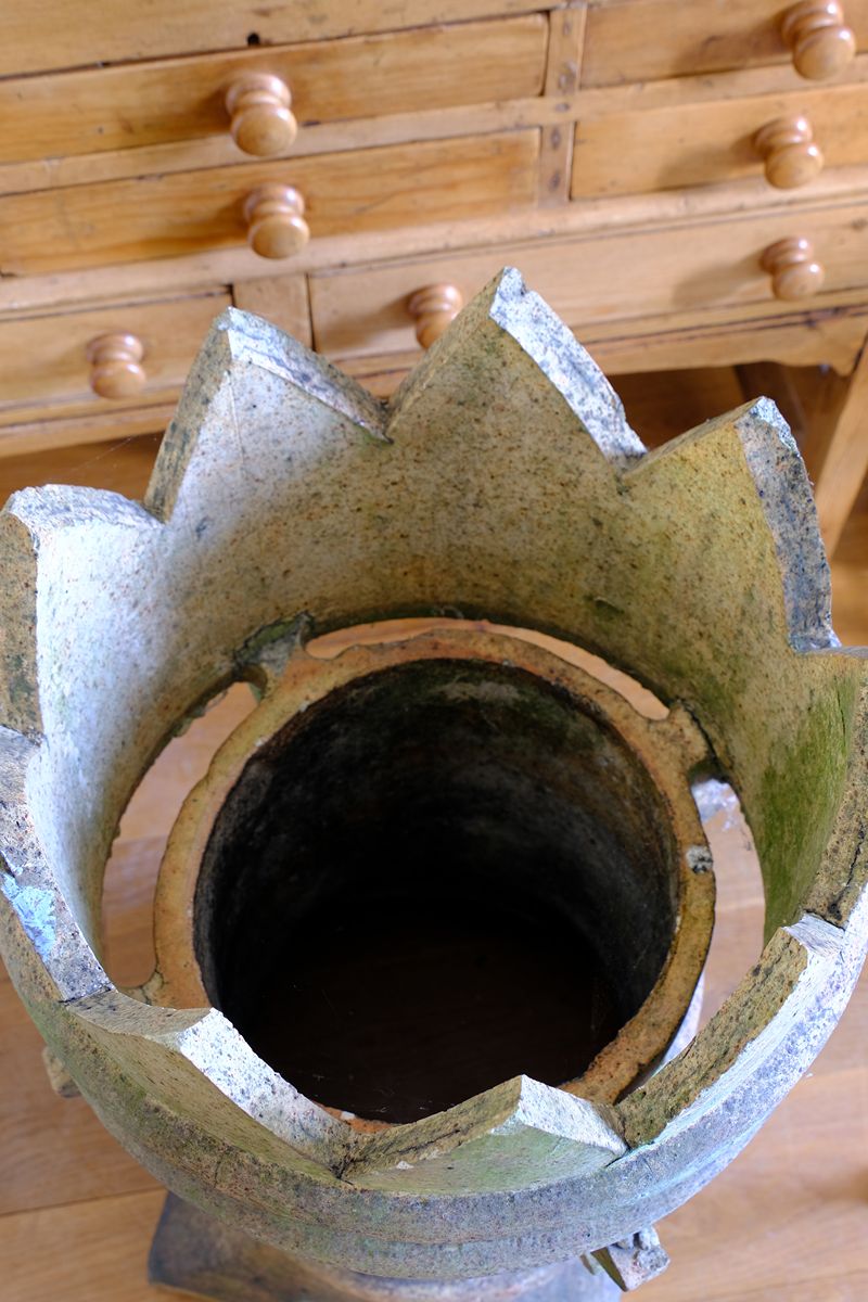 Inside the Late Victorian English buff terracotta crown chimney pot c.1880 with vented body and moulded architectural decoration