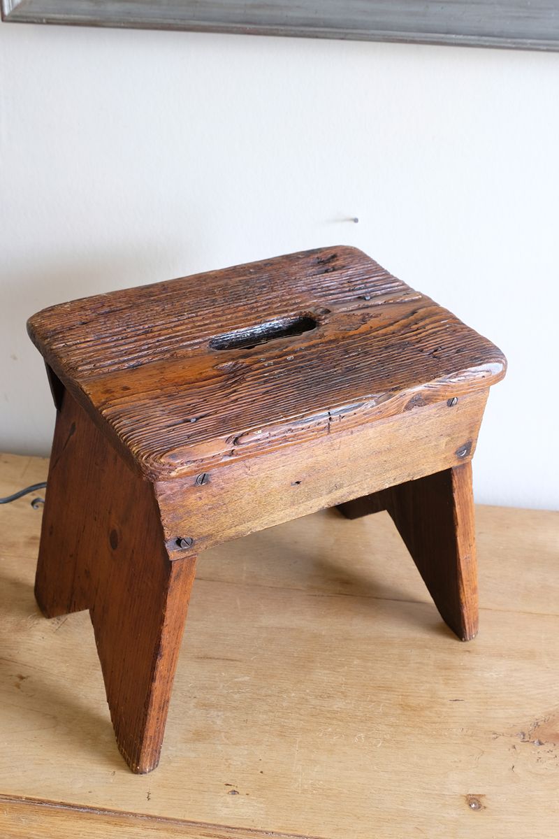 Looking at the top of a 19th Century Vernacular Pine Stool with V-Cut Sides and Worn Grab Handle Seat