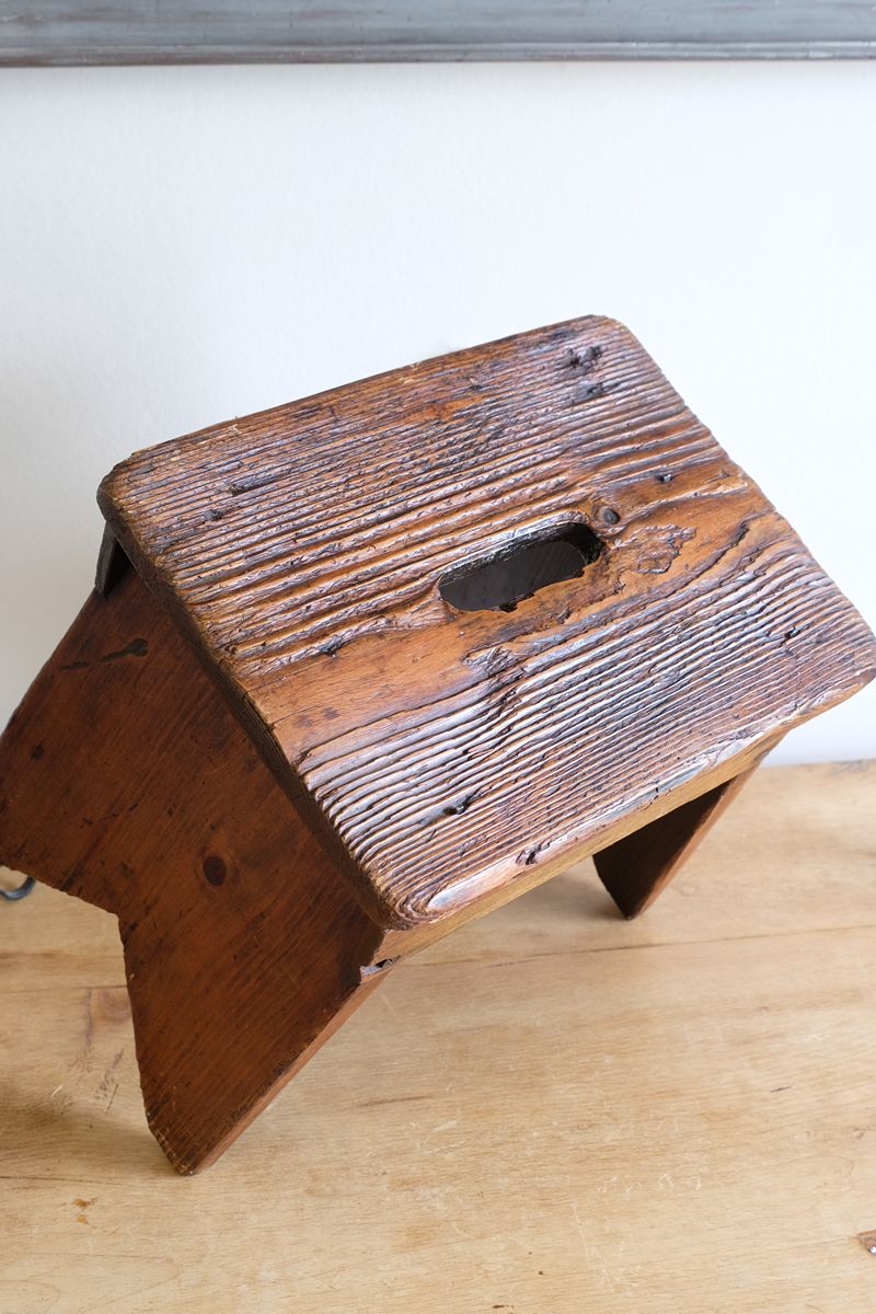 Seat grain on a 19th Century Vernacular Pine Stool with V-Cut Sides and Worn Grab Handle Seat