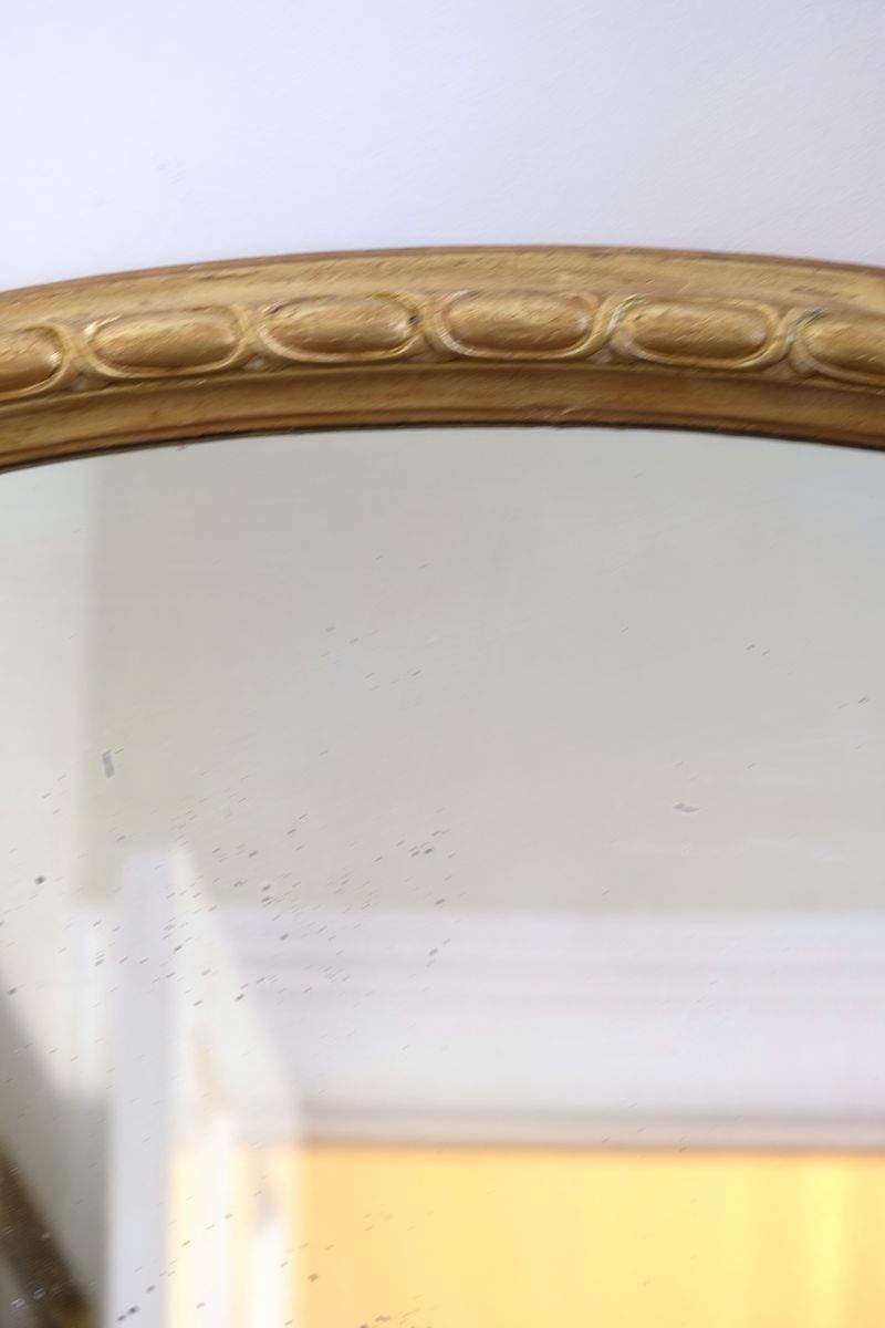a continuous carved giltwood guilloche border of elongated oval reserves on the Mid-19th Century Giltwood Pier and Overmantel Mirror by John Westley Birmingham