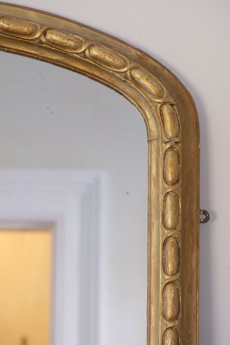a continuous carved giltwood guilloche border of elongated oval reserves on the Mid-19th Century Giltwood Pier and Overmantel Mirror by John Westley Birmingham