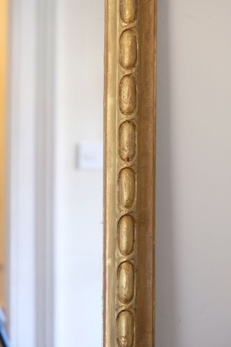 a continuous carved giltwood guilloche border of elongated oval reserves on the Mid-19th Century Giltwood Pier and Overmantel Mirror by John Westley Birmingham