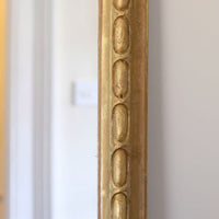 a continuous carved giltwood guilloche border of elongated oval reserves on the Mid-19th Century Giltwood Pier and Overmantel Mirror by John Westley Birmingham