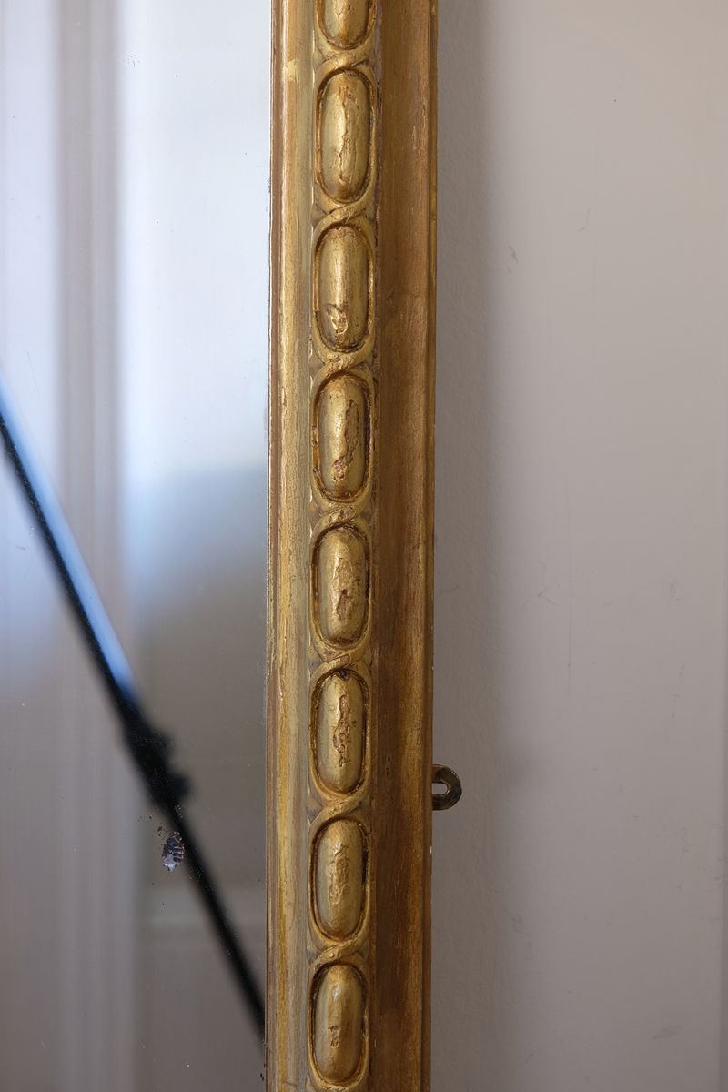 a continuous carved giltwood guilloche border of elongated oval reserves on the Mid-19th Century Giltwood Pier and Overmantel Mirror by John Westley Birmingham