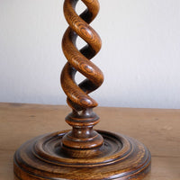 Pair of tall antique oak open barley twist candlesticks with original brass sconces and weighted circular bases