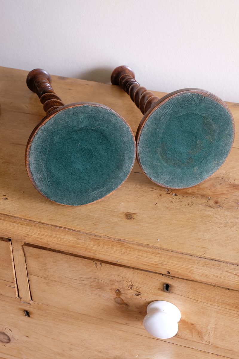 Pair of tall antique oak open barley twist candlesticks with original brass sconces and weighted circular bases