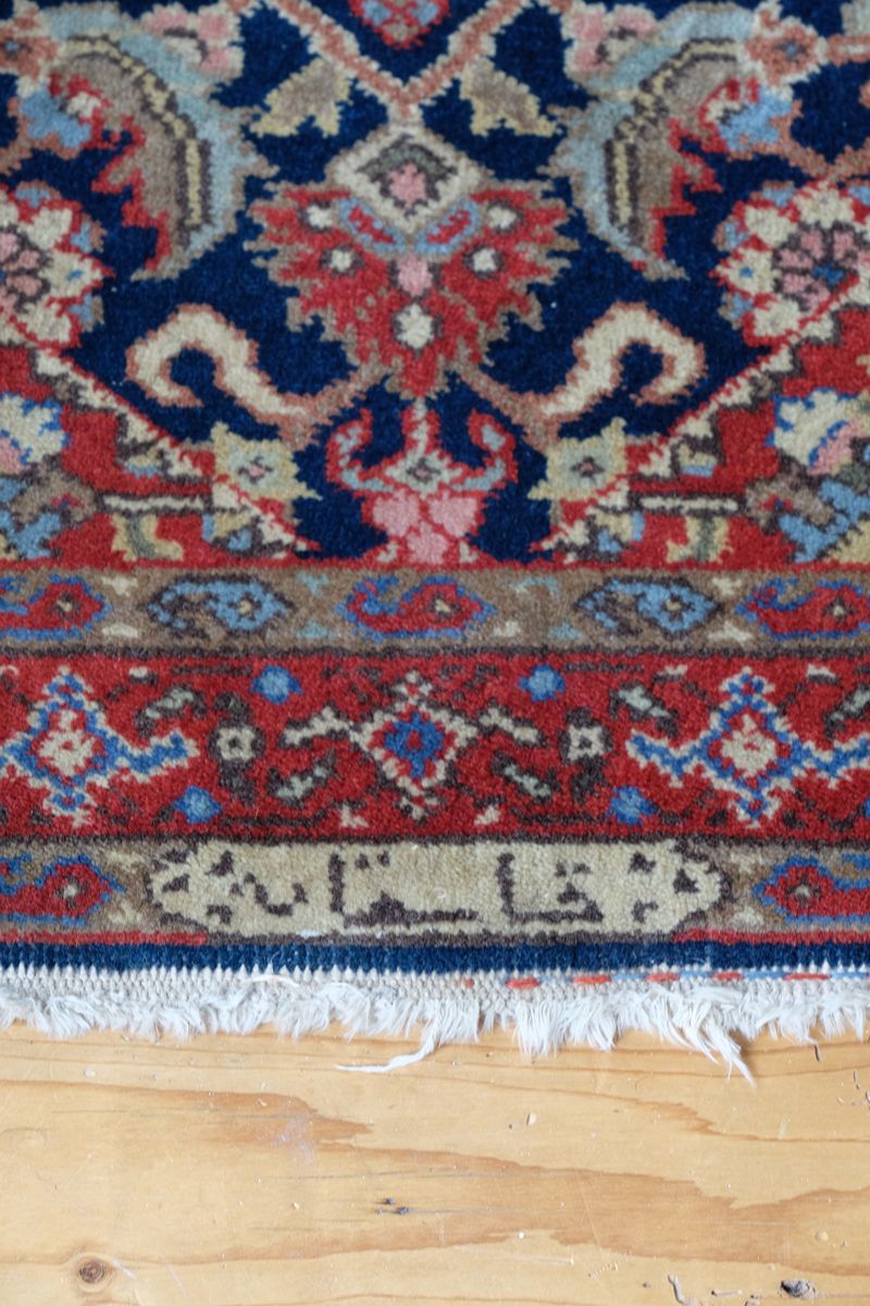 End and side detail of the inscribed antique Persian runner
