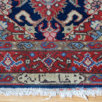 End and side detail of the inscribed antique Persian runner