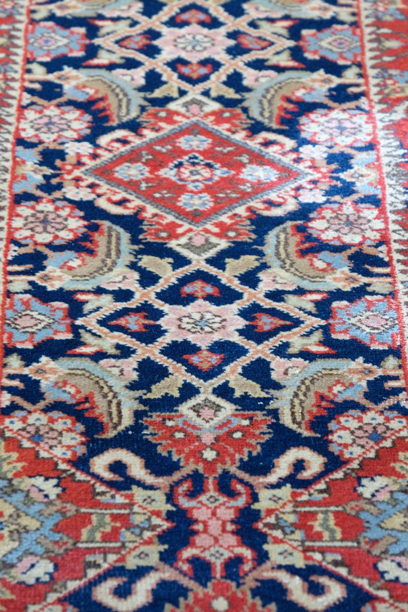Multiple floral borders and indigo field of the North-West Persian runner