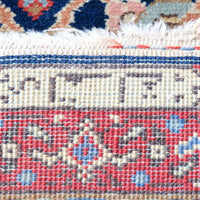 Woven Persian inscription within the ivory end cartouche of the antique runner