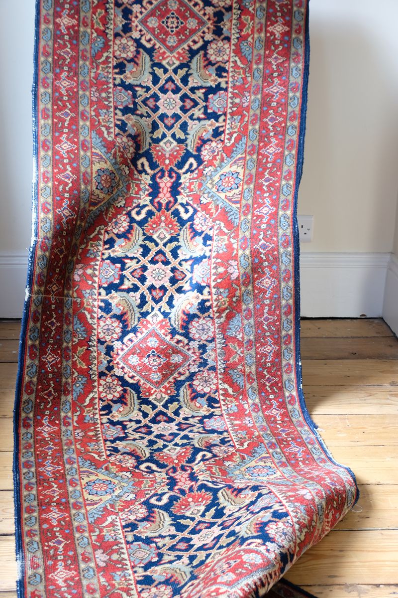 Multiple floral borders and indigo field of the North-West Persian runner