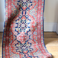 Multiple floral borders and indigo field of the North-West Persian runner