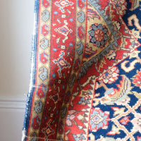 Red floral main border with camel and pale blue guard borders