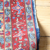 visible natural wear on this Red floral main border with camel and pale blue guard borders