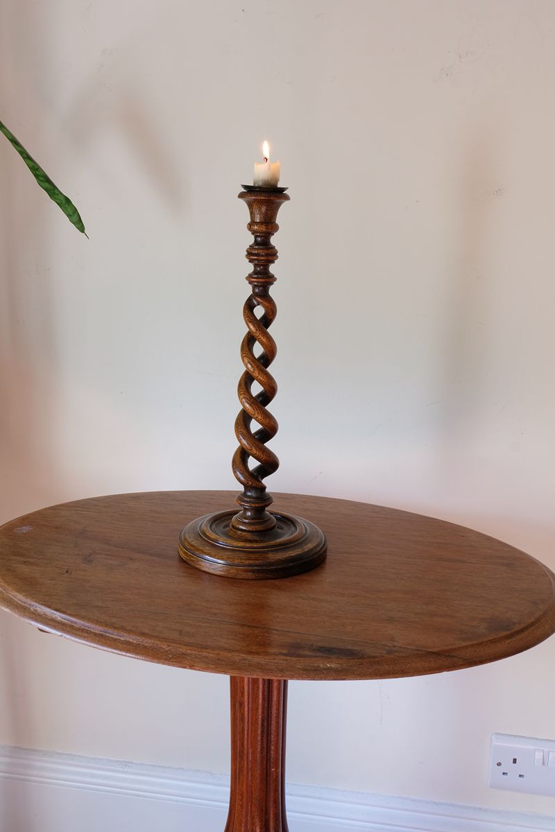 Antique English oak open barley-twist candlestick dating to circa 1900