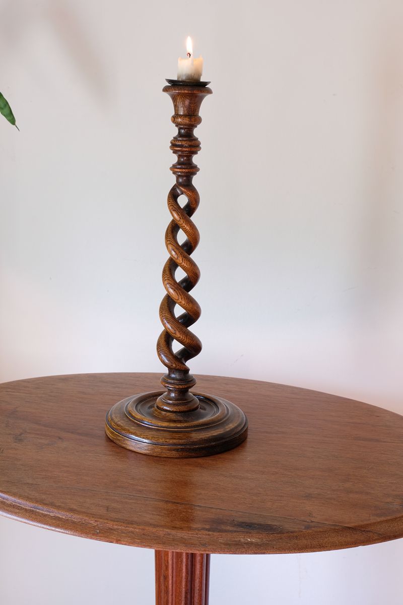 Antique English oak open barley-twist candlestick dating to circa 1900