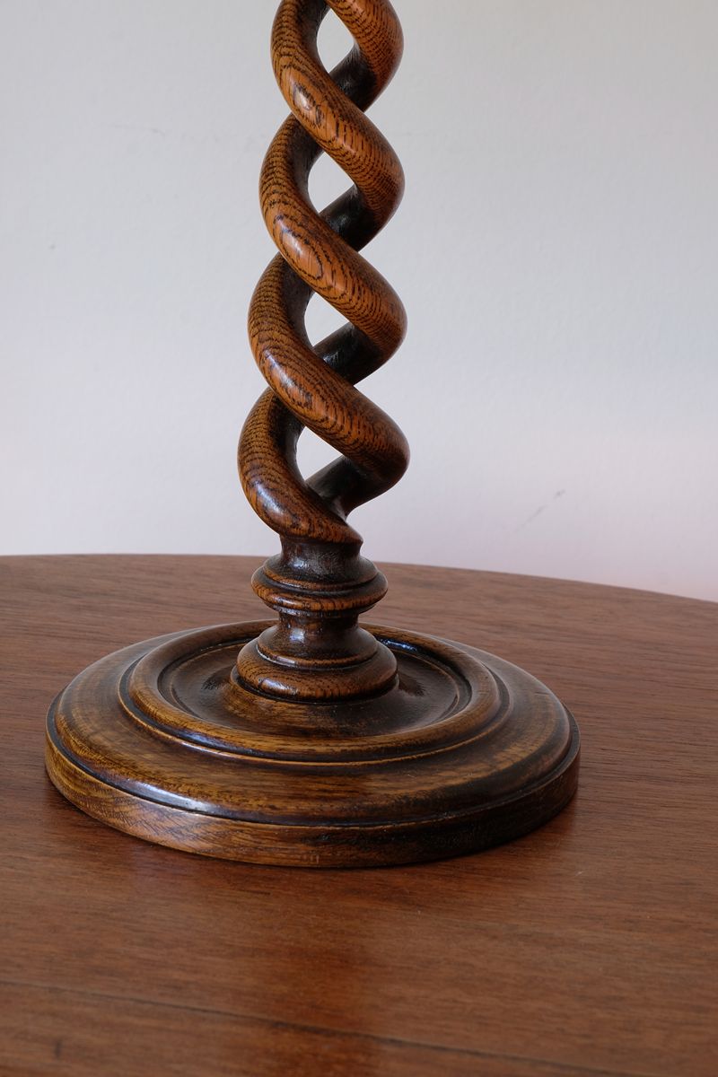 Pronounced oak grain following the deeply carved spiral candlestick stem