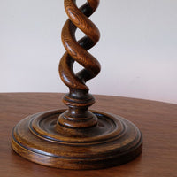 Pronounced oak grain following the deeply carved spiral candlestick stem