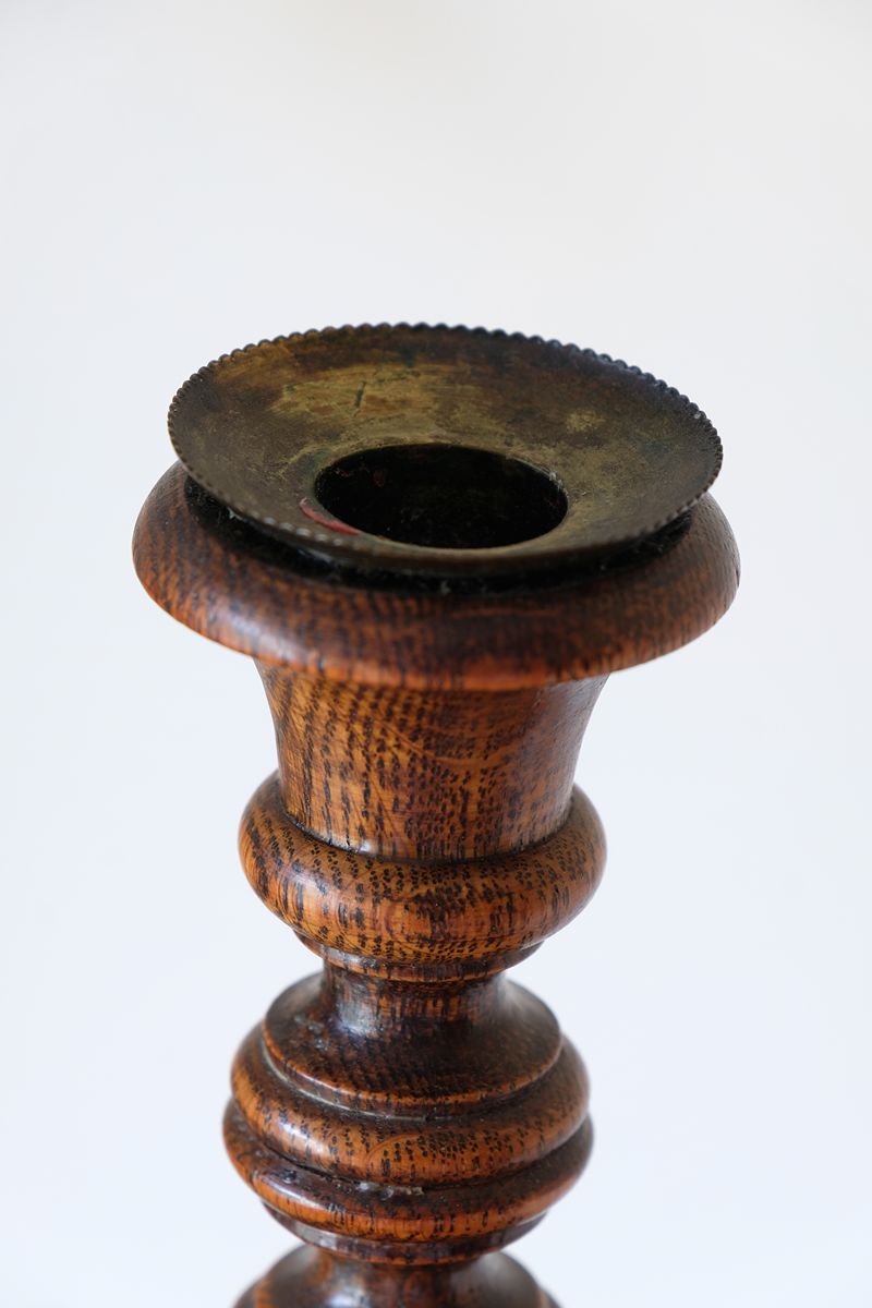 Naturally aged brass candle sconce with oxidation and traces of old wax