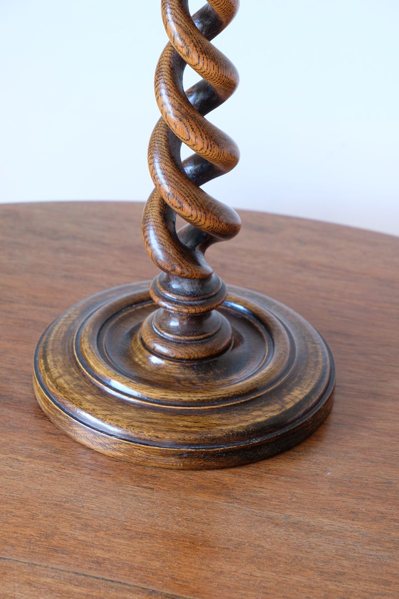 Antique English oak open barley-twist candlestick dating to circa 1900
