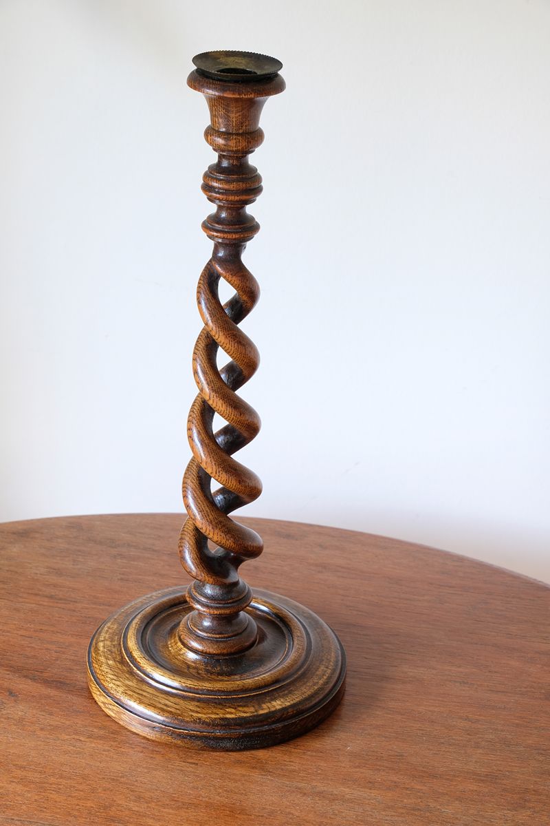 Antique English oak open barley-twist candlestick dating to circa 1900