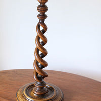 Antique English oak open barley-twist candlestick dating to circa 1900