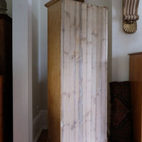 tongue and grooved back n the Antique pine cupboard, circa 1890–1910, with a boarded door, two pierced ventilation panels and a plinth base