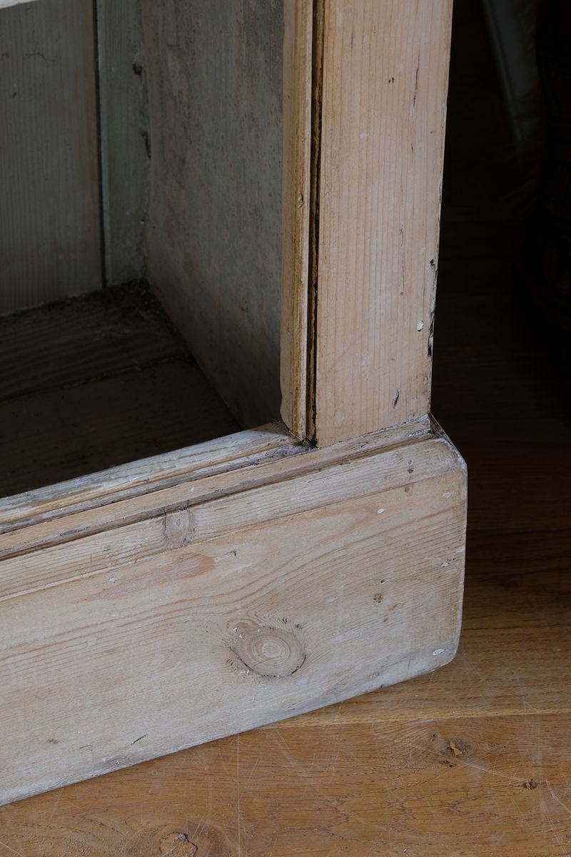 profiled plinth on the Antique pine cupboard, circa 1890–1910, with a boarded door, two pierced ventilation panels and a plinth base