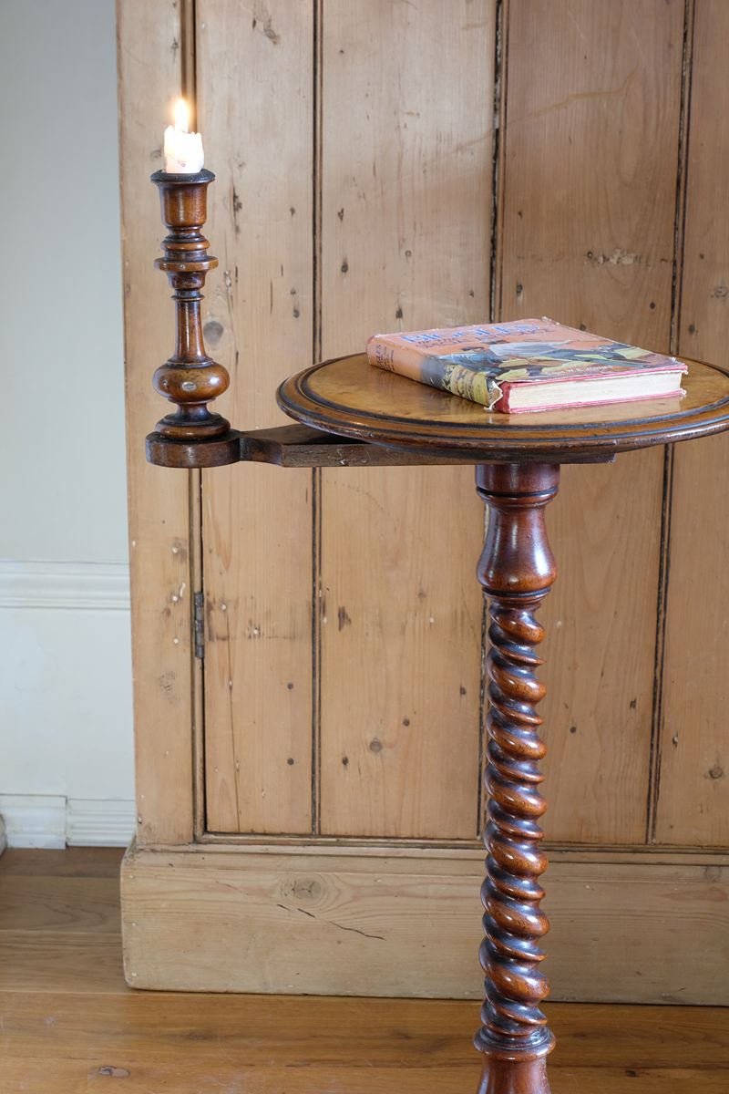 Mid-Victorian burr walnut candle stand with fixed candle arm and barley-twist column