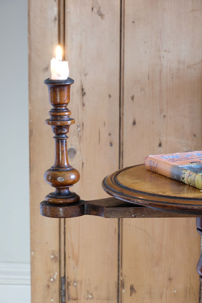 Close up of the fixed arm on the Mid-Victorian burr walnut candle stand with fixed candle arm and barley-twist column
