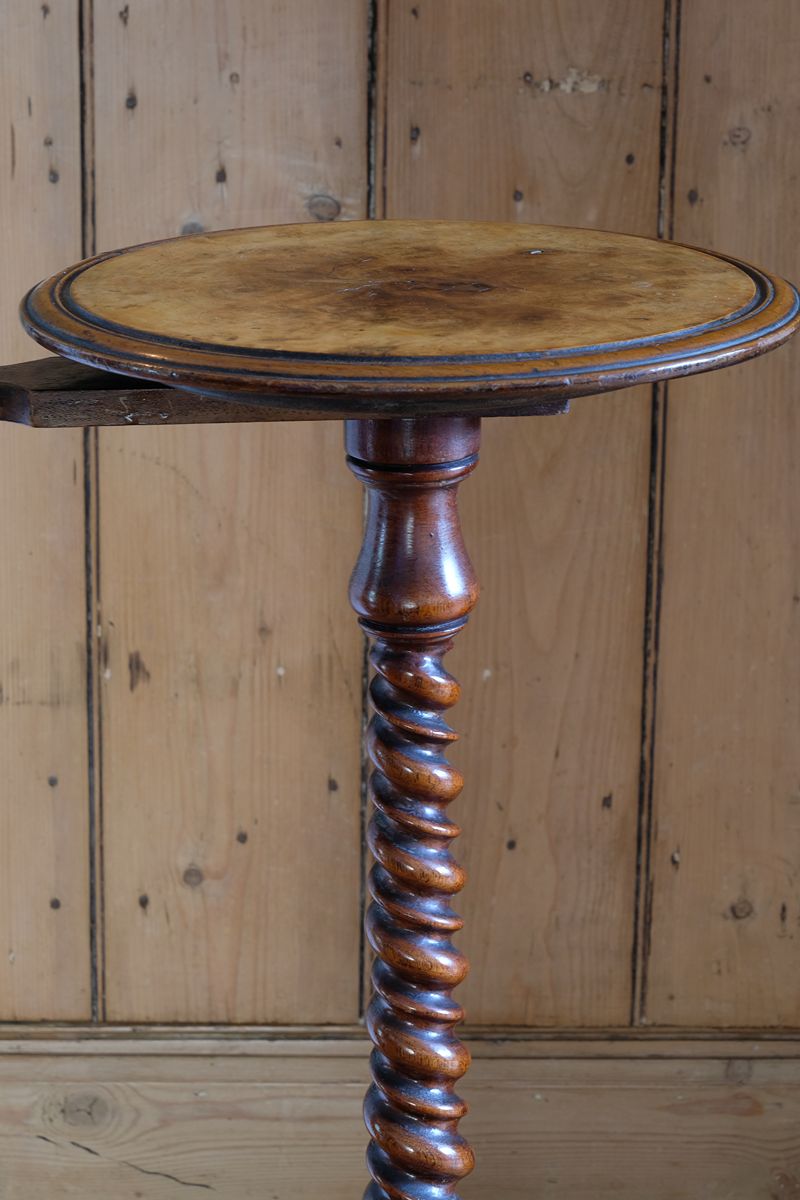 Mid-Victorian burr walnut candle stand with fixed candle arm and barley-twist column