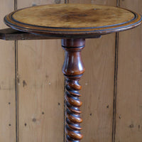 Mid-Victorian burr walnut candle stand with fixed candle arm and barley-twist column