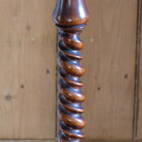 Mid-Victorian burr walnut candle stand with fixed candle arm and barley-twist column