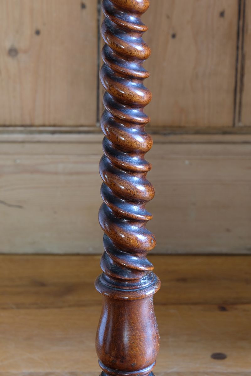 Mid-Victorian burr walnut candle stand with fixed candle arm and barley-twist column