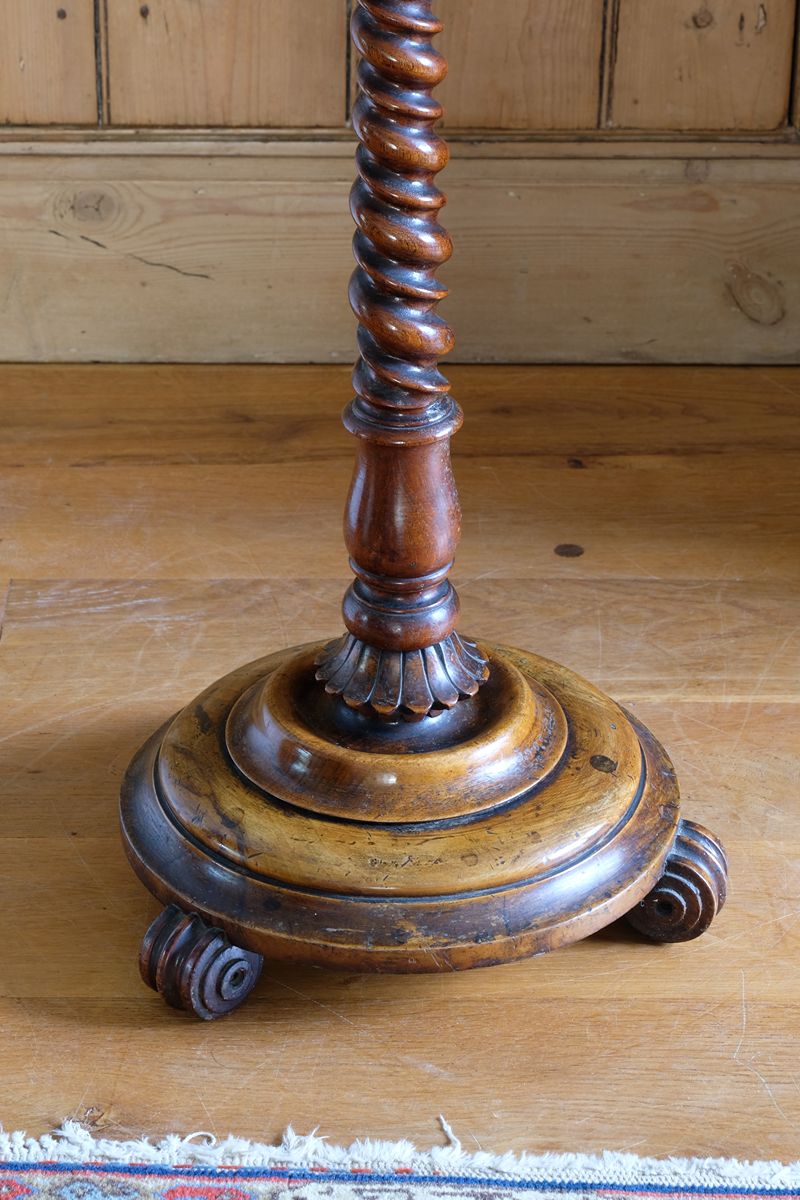 Mid-Victorian burr walnut candle stand with fixed candle arm and barley-twist column